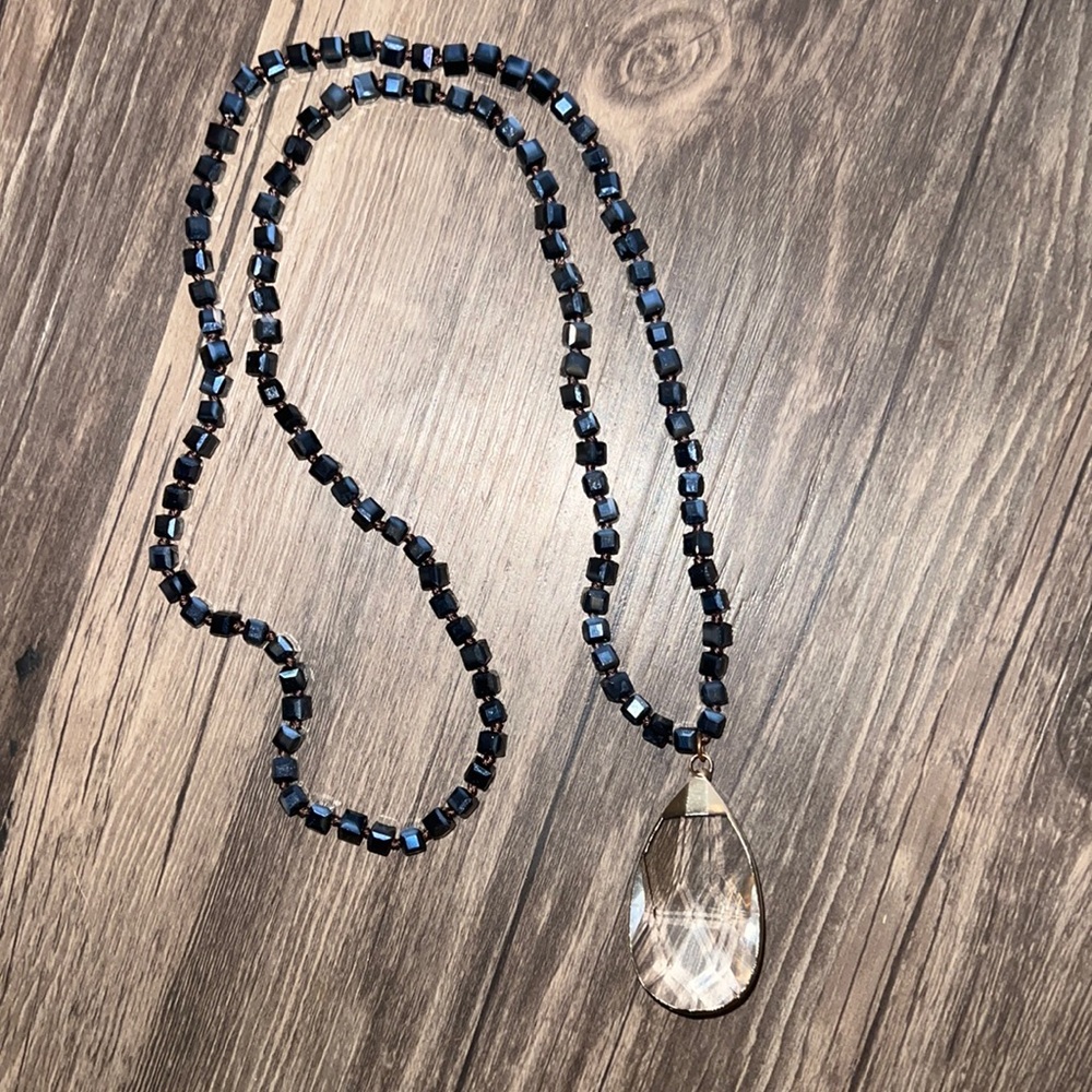 Long beaded necklace with large teardrop dangle